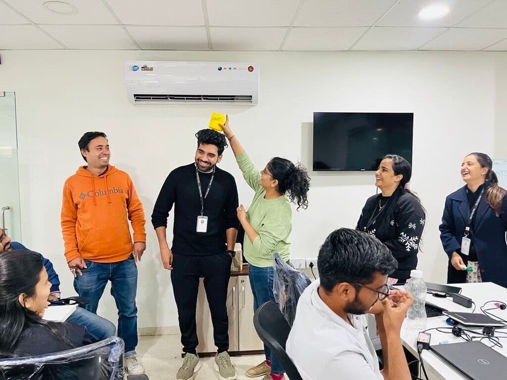 Techdome engineers sharing a laugh during an office moment